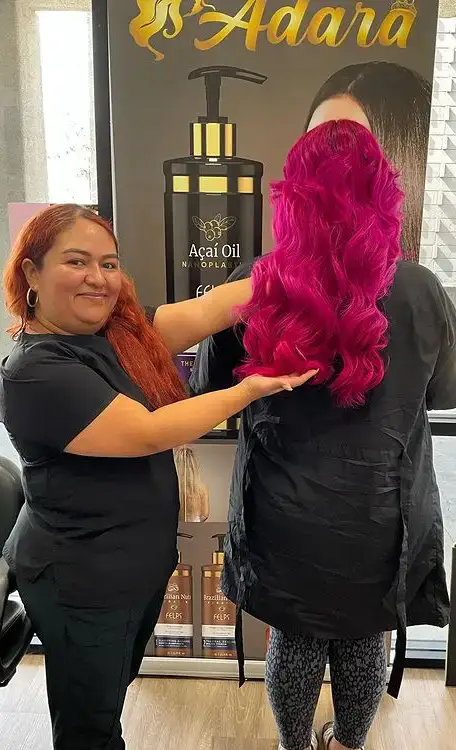 a person standing next to another person hair color desig a person standing next to another person hair color desig