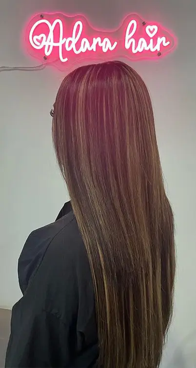 a person standing next to another person hair color desig