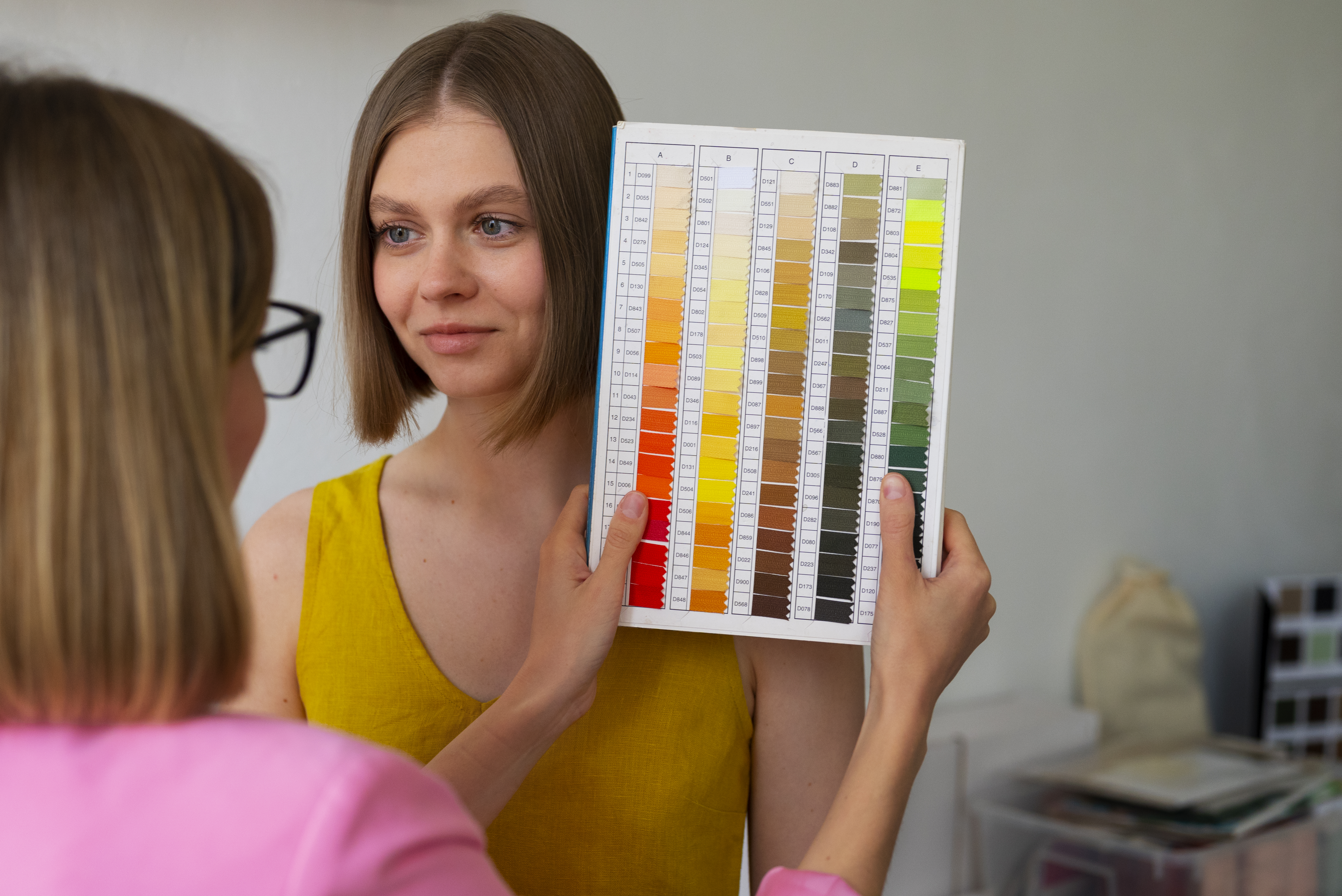 a person standing next to another person hair color desig