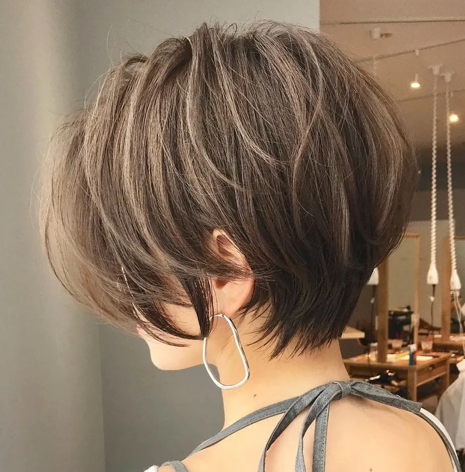 a person standing next to another person hair color desig