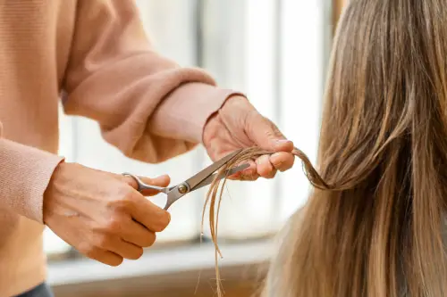 a person standing next to another person hair color desig